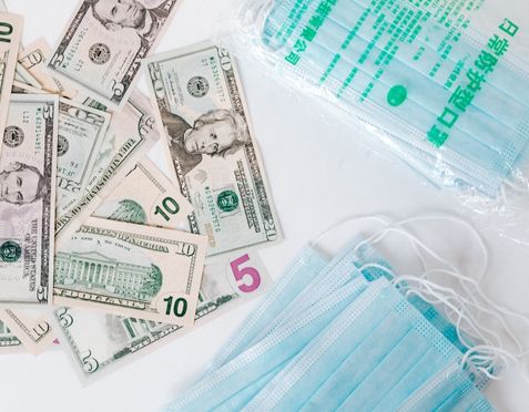 Surgical masks with dollar bills