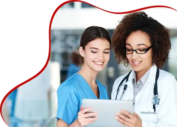 Two healthcare professionals smiling while looking at a tablet. One is wearing a blue scrub, and the other is in a white coat with a stethoscope. A red wave-shaped border is on the left side of the image.